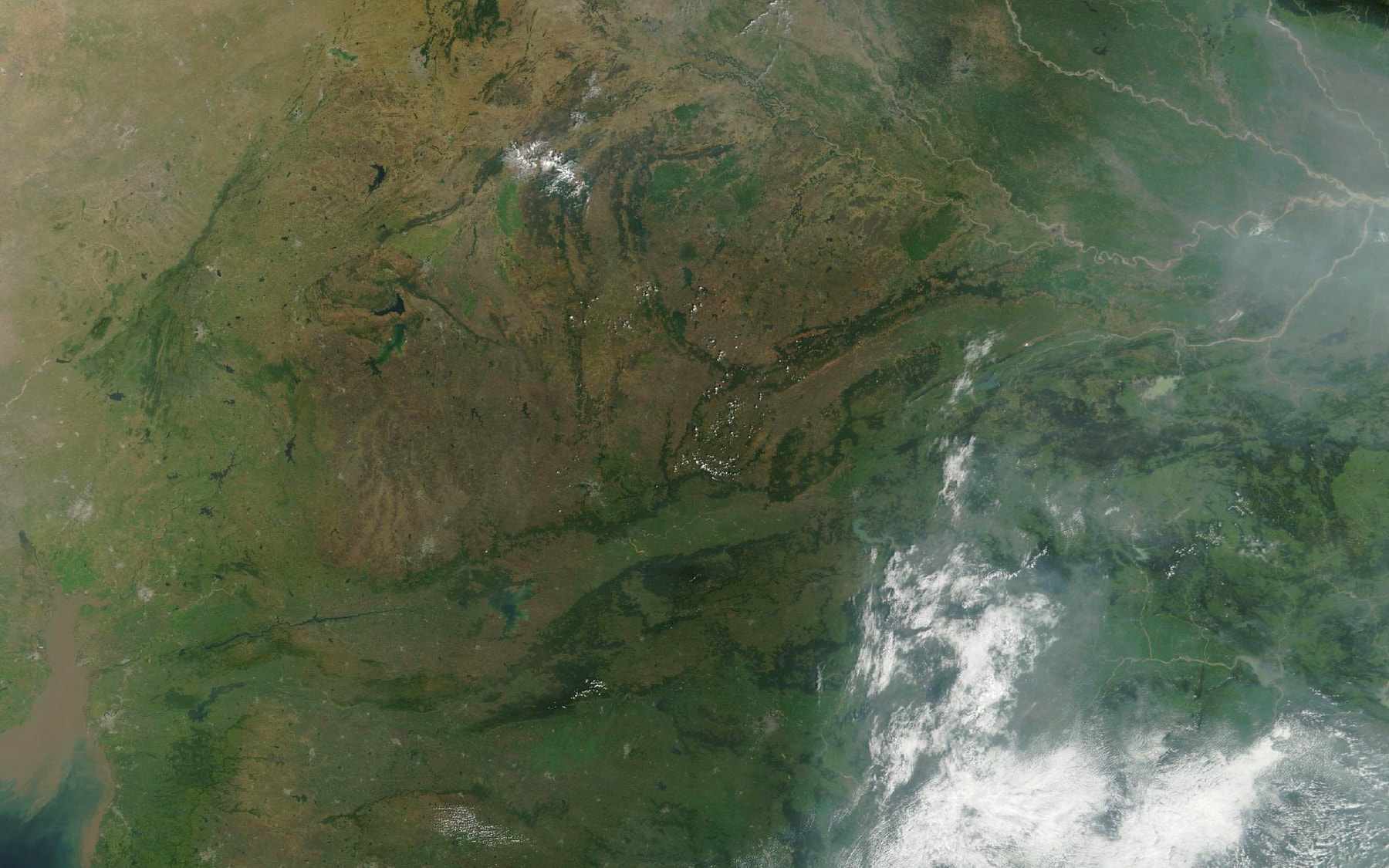 Satellite view of Madhya Pradesh in October, the Narmada running west across the state and Narsinghpur district outlined on it.